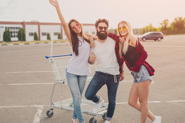 Cheerful friends during shopping in weekend