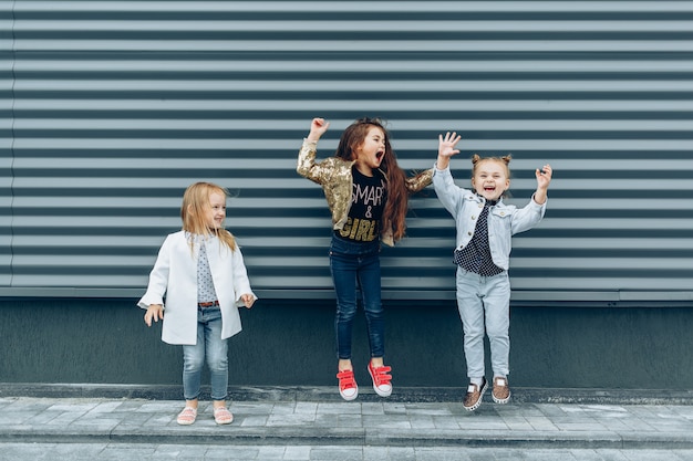 Cheerful funny girls having fun and jumping