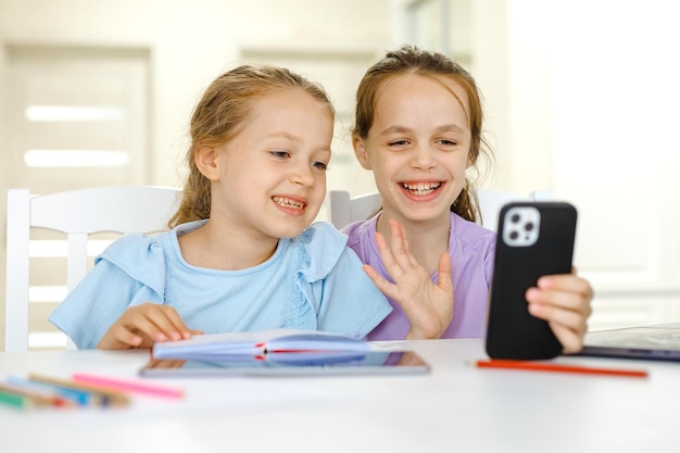 Cheerful girls having online lesson