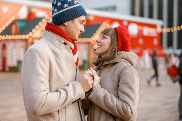 Cheerful happy and beautiful caucasian couple having date together outdoors