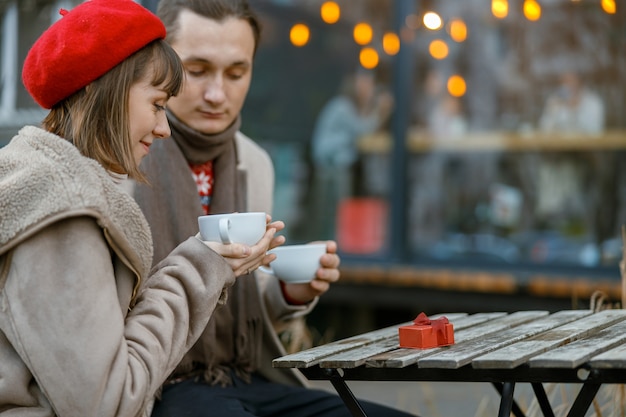 Cheerful happy and beautiful caucasian couple having date together outdoors