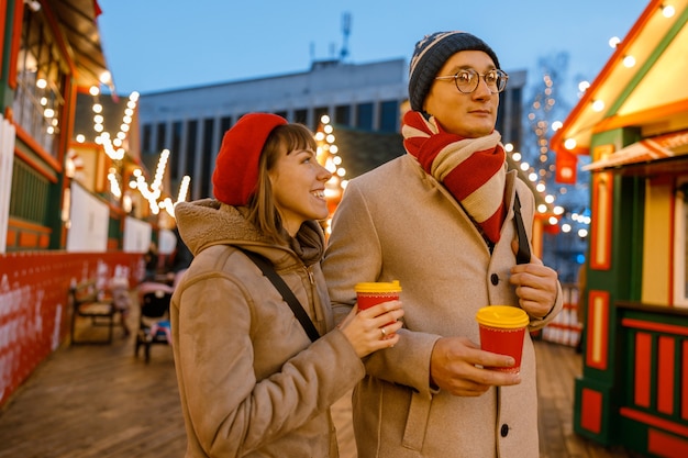 Cheerful happy and beautiful caucasian couple having date together outdoors