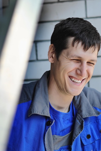 A cheerful and happy employee smiles at the workplace