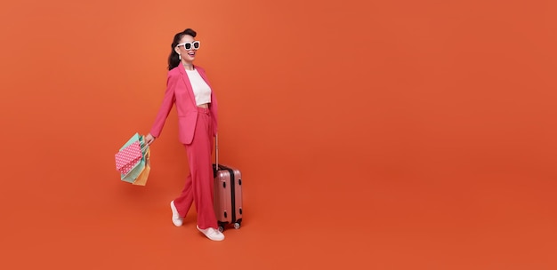 Cheerful happy woman enjoying shopping she is carrying shopping bags