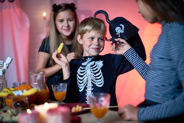 Cheerful kids having fun at Halloween party