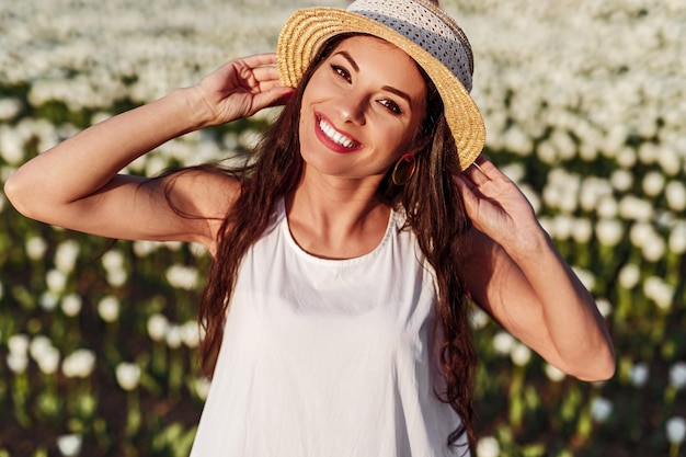 Cheerful lady in flower field