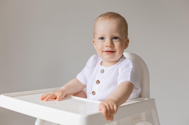 cheerful little boy in high chair, health, space for text, banner, card