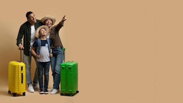 Cheerful loving black family tourists travelling together copy space