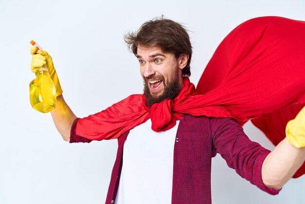 Cheerful male cleaner professional red raincoat housework lifestyle light background