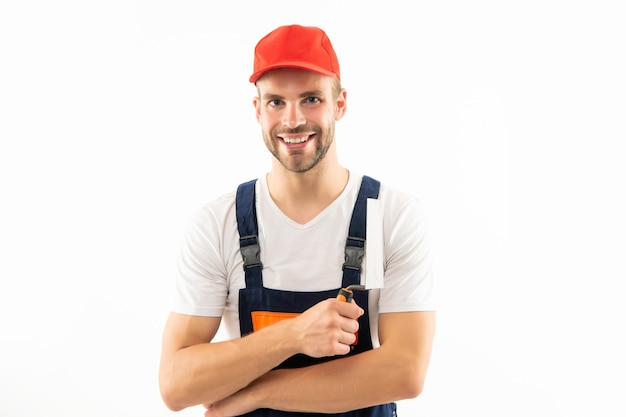 Cheerful man in builder uniform holding trowel isolated on white background plasterer