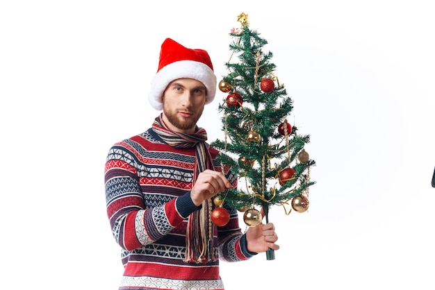 Cheerful man in New Year39s clothes decoration christmas studio posing