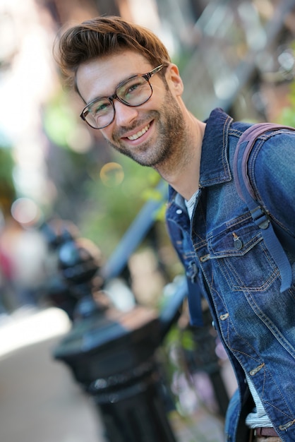 Cheerful man walking in the street