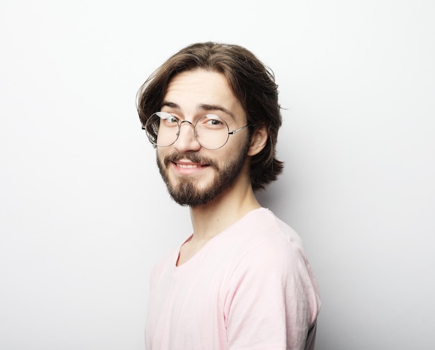 Cheerful man wearing glasses glad to find suitable well paid job