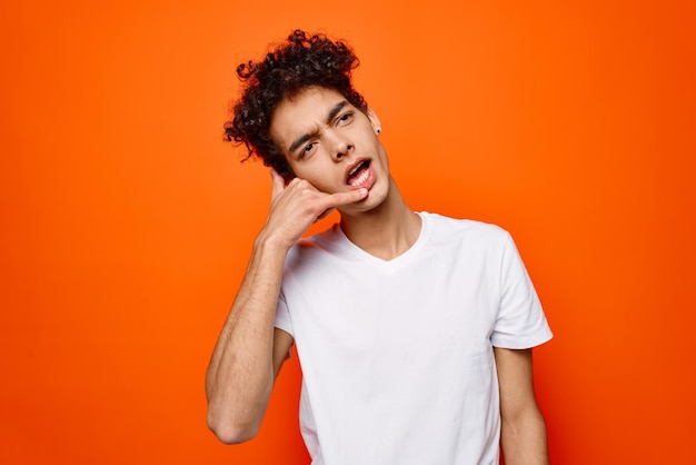 Cheerful man white tshirt gestures with hand emotions fashion