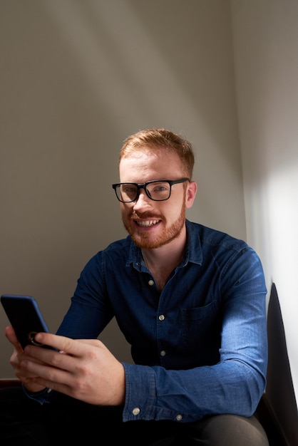 Cheerful man with mobile phone