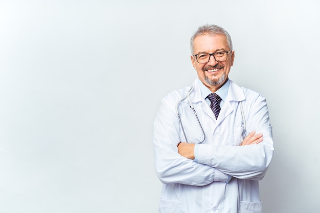 Cheerful mature doctor posing