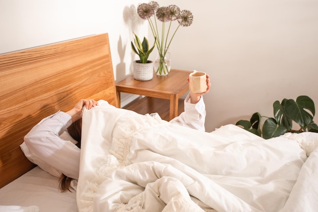 Cheerful morning concept Attractive woman in bed