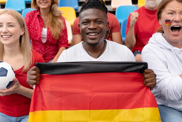 Cheerful people watching a football game