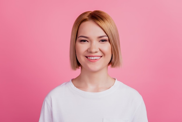 Cheerful positive cute lady shiny beaming smile camera wear white t-shirt isolated on pink background