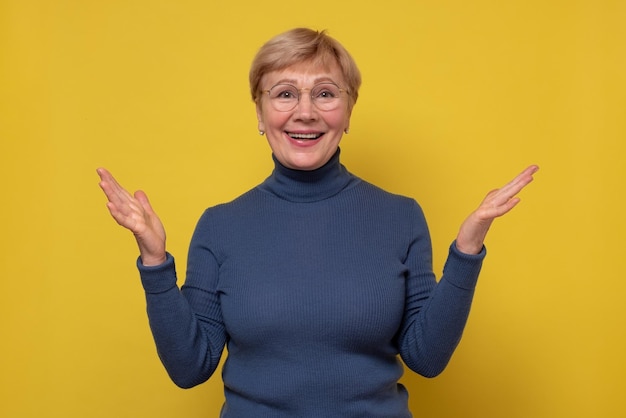 Cheerful positive female teacher with blonde hair glad to see her students