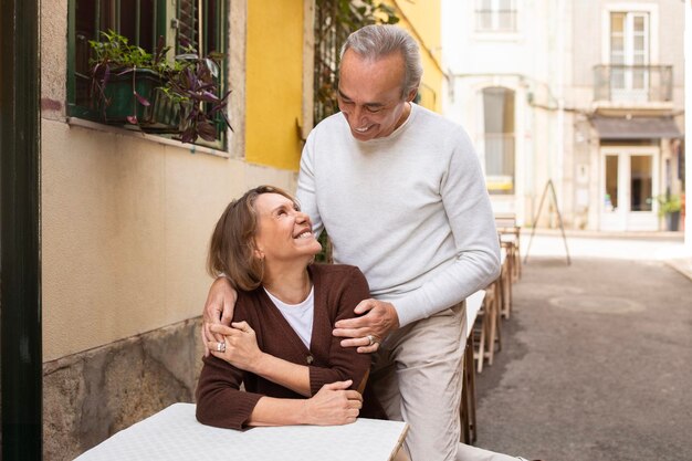 Cheerful Senior Spouses Having Date In Outdoor Cafe During Vacation