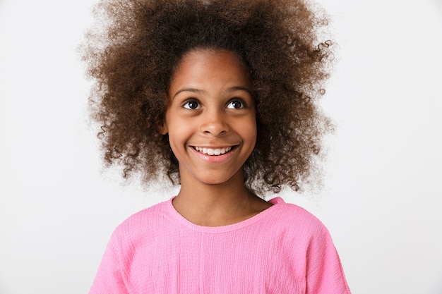 cheerful smiling young african girl kid posing isolated over white wall,.