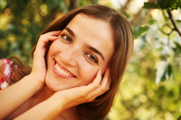 Cheerful woman in the garden