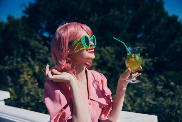 Cheerful woman green glasses glamor cocktail fun Relaxation concept