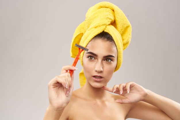 Cheerful woman razor in hand skin care hygiene