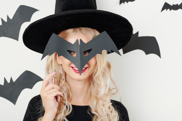 Cheerful woman with Halloween mask