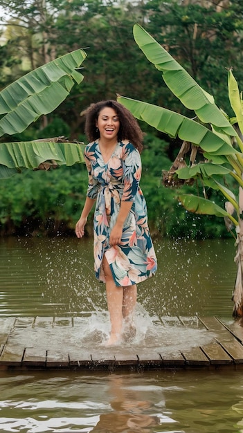 Cheerful woman with tropical banana leaves and water splashes