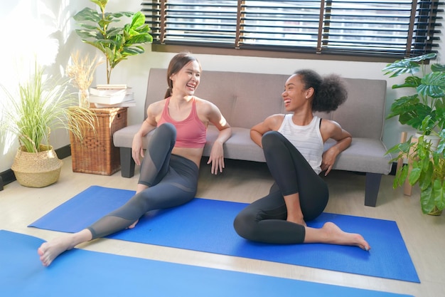 Cheerful women relaxing during a yoga workout session