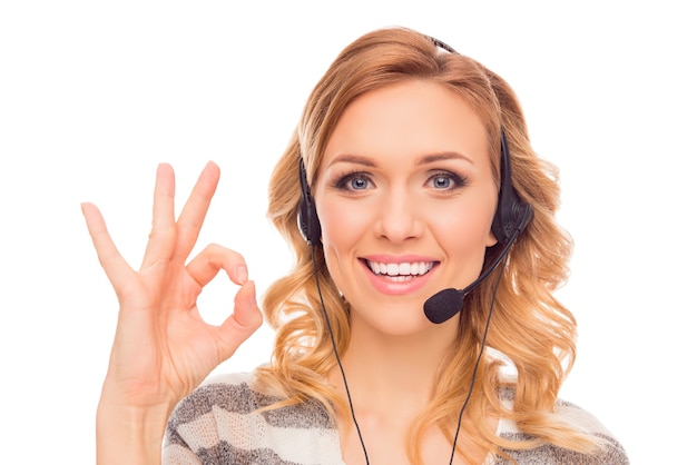 Cheerful young agent of call center gesturing