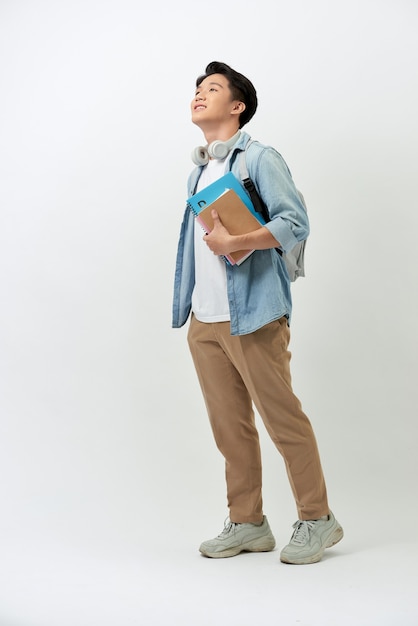 Cheerful young Asian student with a backpack