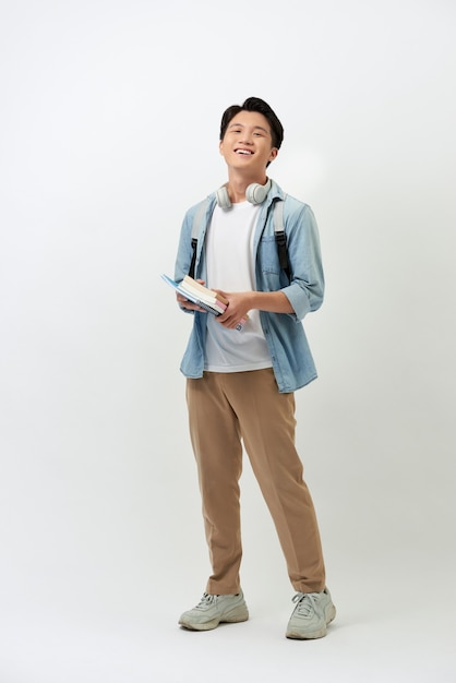 Cheerful young Asian student with a backpack