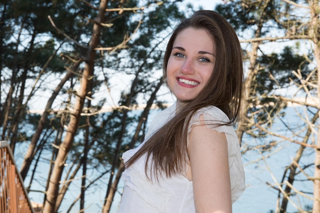 Cheerful young girl enjoying life at the beach