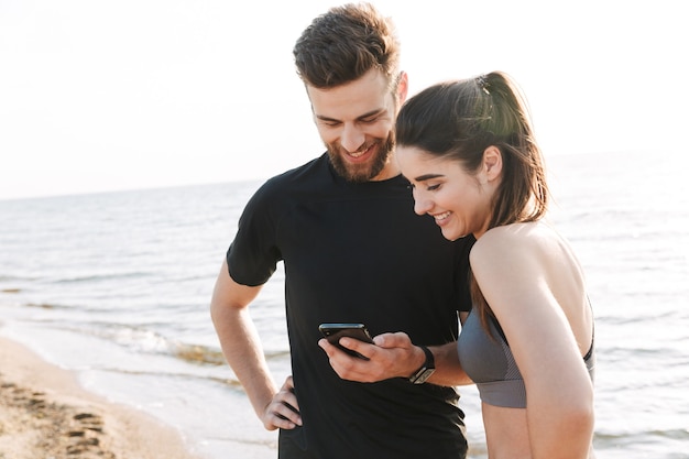 Cheerful young sport couple talking