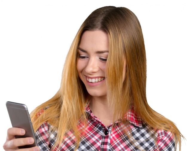 Cheerful young woman holding mobile phone 