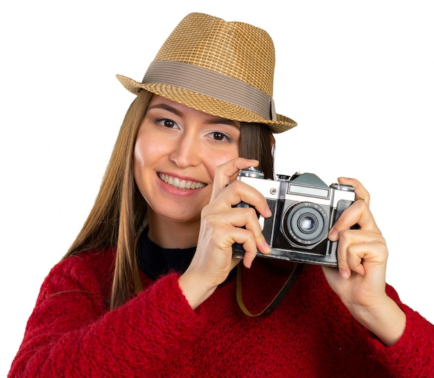 Cheerful young woman with camera 