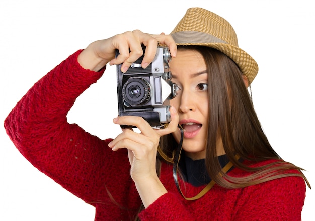 Cheerful young woman with camera 