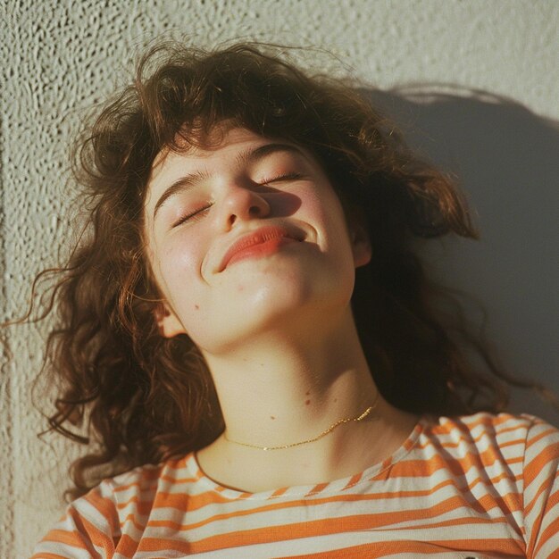 Cheerful young woman with closed eyes