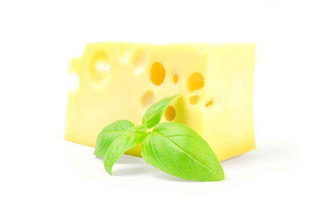 Cheese and basil leaves isolated on white background cutout