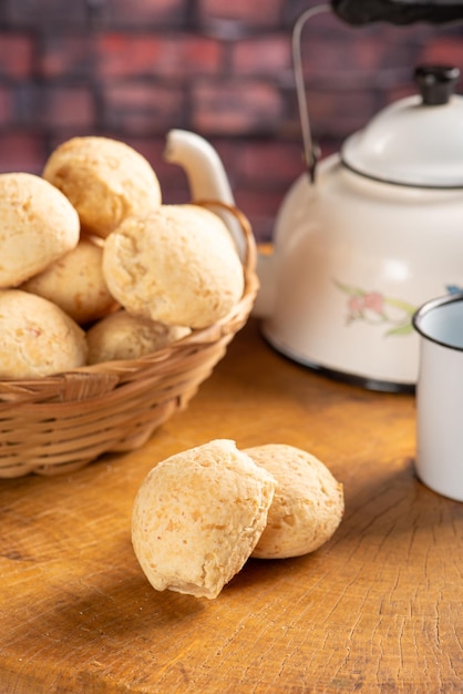 Cheese bread basket with cheese bread arranged on rustic wood dark background selective focus