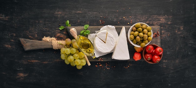 Cheese brie From mildew Top view On a wooden background Free copy space