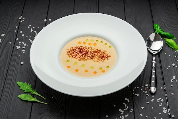 Cheese cream soup on a dark background