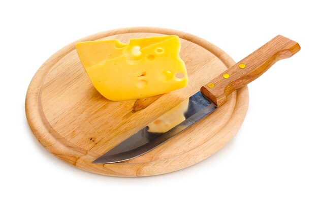 Cheese on cutting board with knife isolated on white