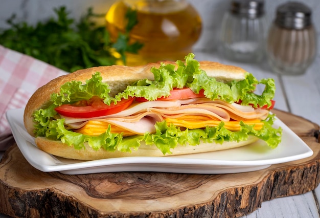 Cheese ham lettuce and tomato slices in an appetizing tasty sandwich