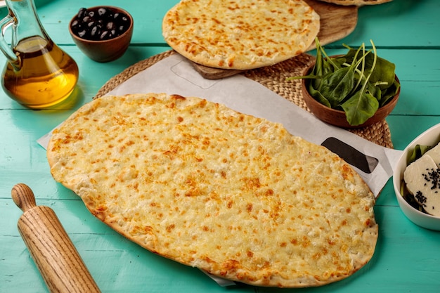 Cheese Mashrooha pizza served in a dish isolated on cutting board side view