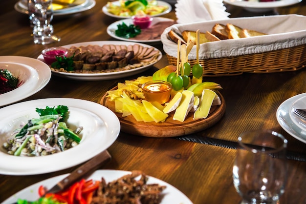 Cheese plate on a table with different dishes