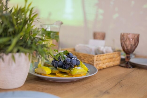 Cheese plate with cheeses Dorblu Parmesan Brie Camembert and Roquefort in serving on the table from an old tree closeup